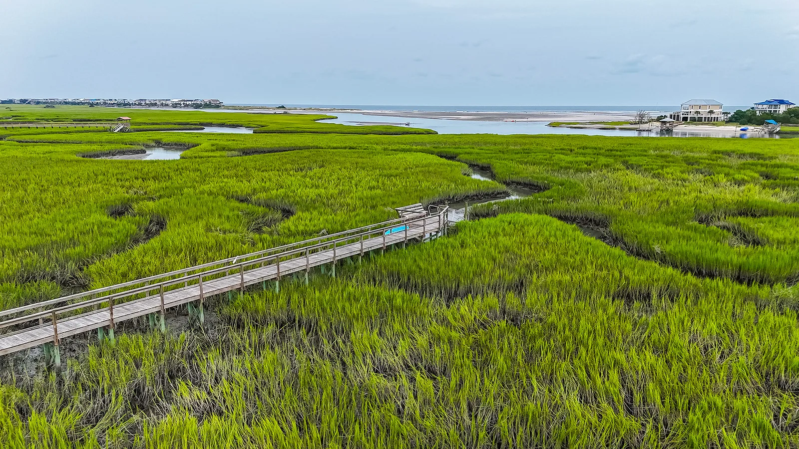 A boardwalk running out across the salt marsh at Oak Lea on Pawleys Island